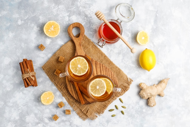 A cup of tea,brown sugar,honey and lemon on concrete  . Top view, copy space