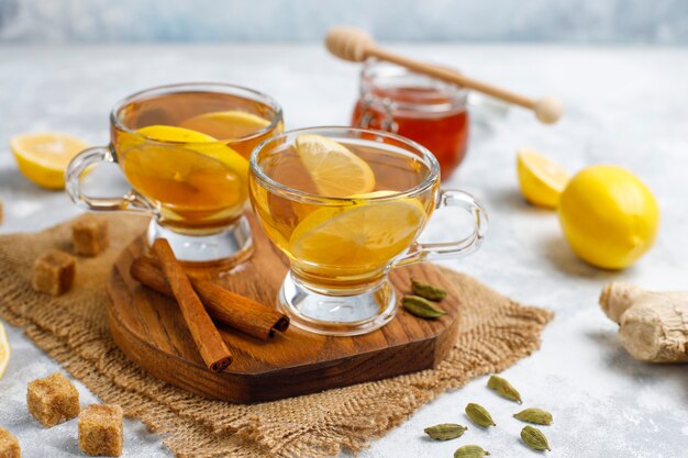 A cup of tea,brown sugar,honey and lemon on concrete  . Top view, copy space