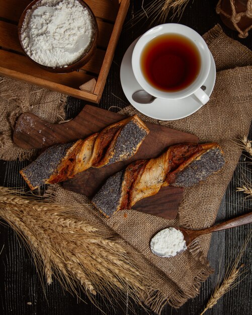 A cup of tea is bread on a dark retro background