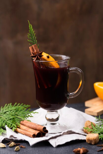 Cup of tea with lemon and cinnamon on table