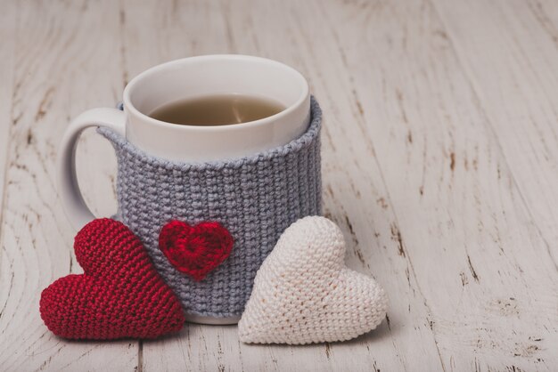 Cup of tea with two teddy hearts
