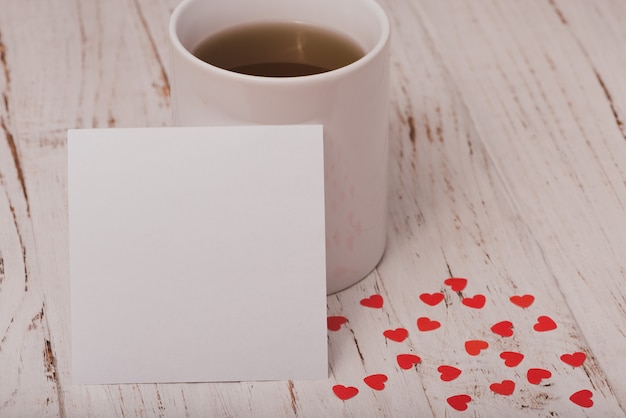 Cup of tea with a white poster