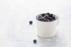 Free photo cup with blueberries