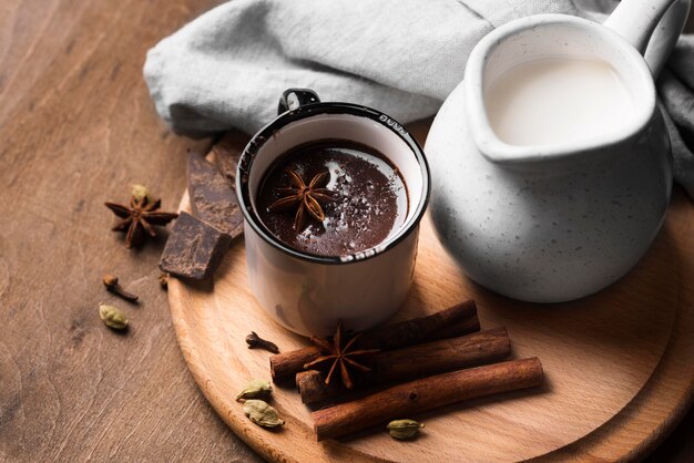 Cup with hot chocolate aromatic drink on table