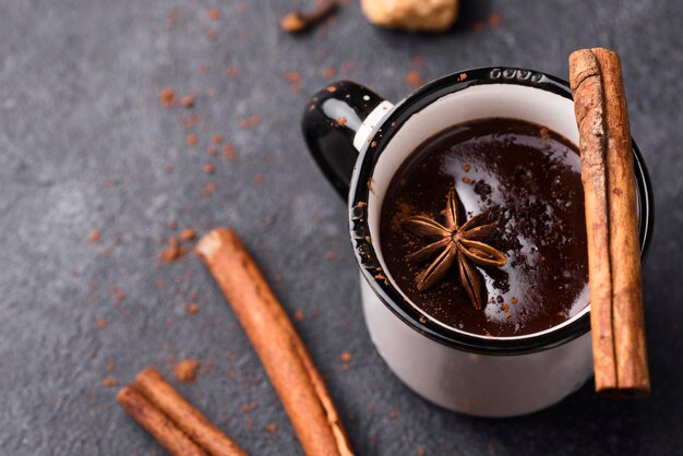 Cup with hot chocolate and cinnamon