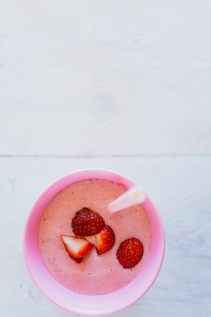 Cup with strawberry milkshake