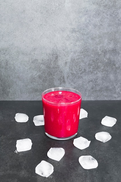 Cup with strawberry smoothie