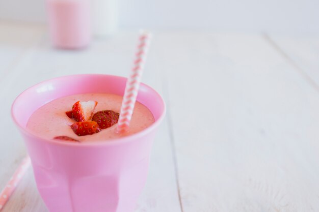 Cup with yummy strawberry smoothie