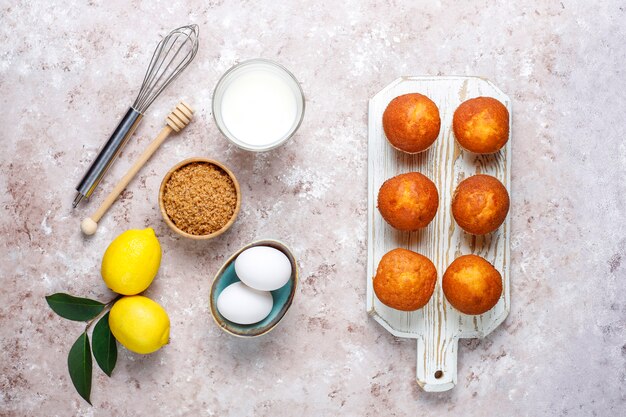 Cupcake baking background with kitchen utensils.