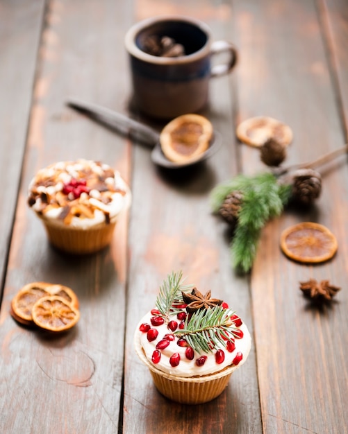 Free photo cupcake decorated with pomegranate and anise