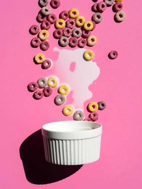 Free photo cupcake form with fruit loops and milk