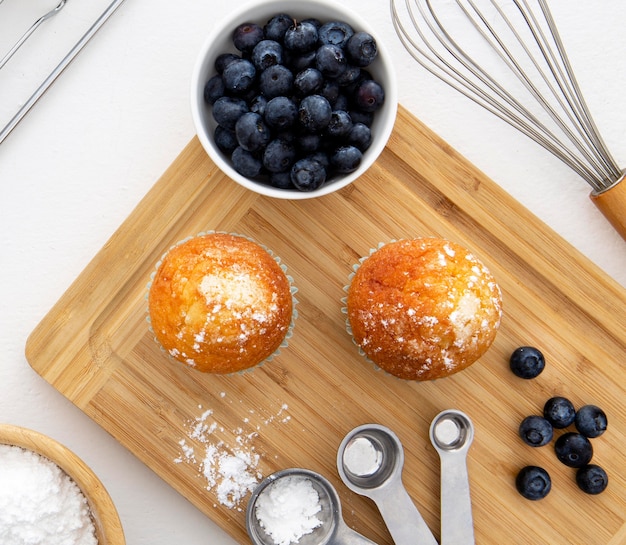 Free photo cupcakes and blueberries top view