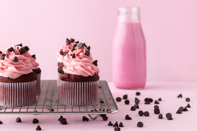 Cupcakes with pink icing and pink drink