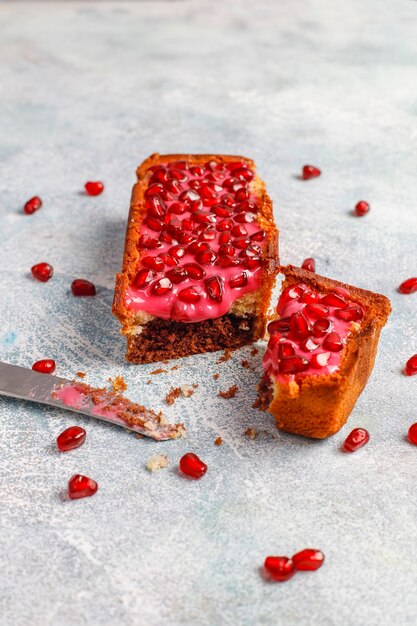 Cupcakes with pomegranate topping and seeds.