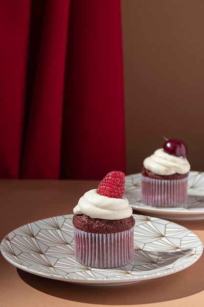 Cupcakes with raspberry and cherry