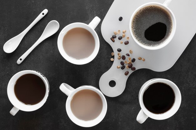 Cups of coffee on table