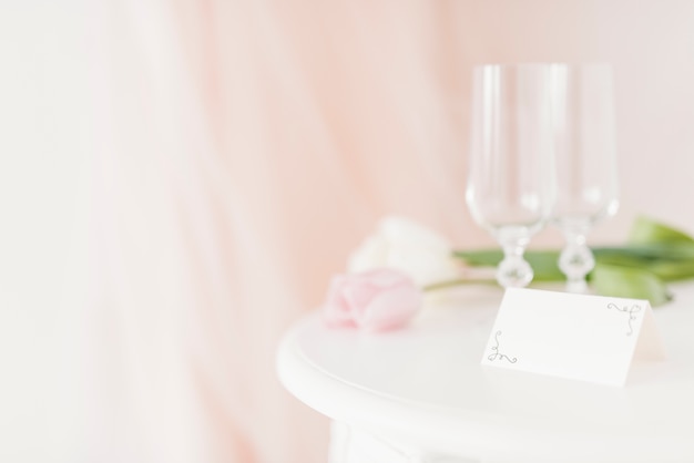 Cups and flowers on table