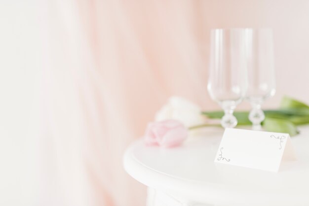 Cups and flowers on table