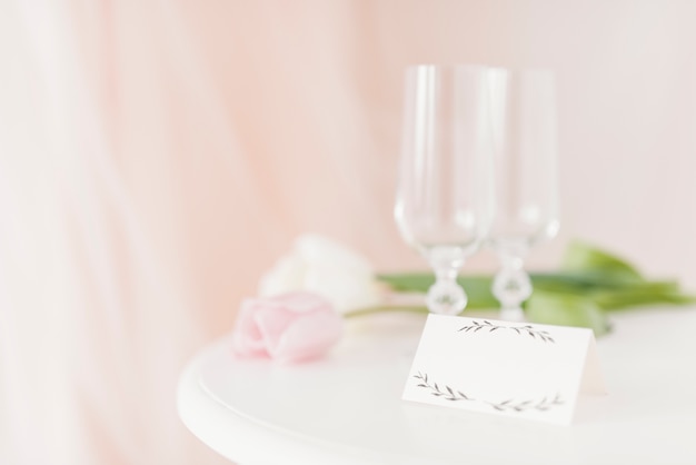 Cups and flowers on table