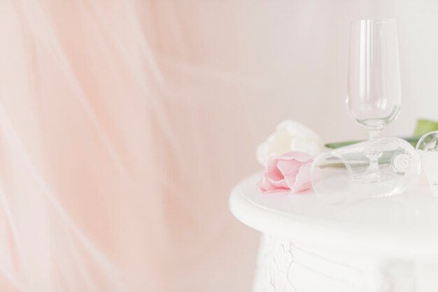 Cups and flowers on table