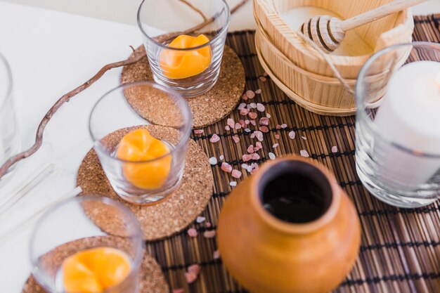 Cups and jug with aromatherapy supplies