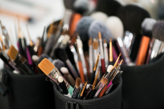 Cups with makeup brushes