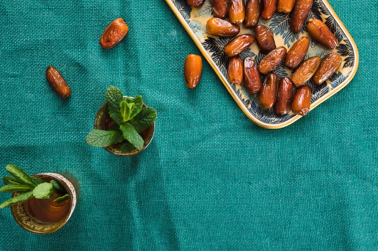 Free Photo cups with plant twigs and dried fruits on tray