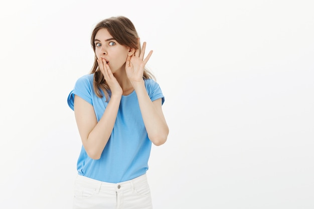 Curious blond woman overhear conversation, eavesdropping