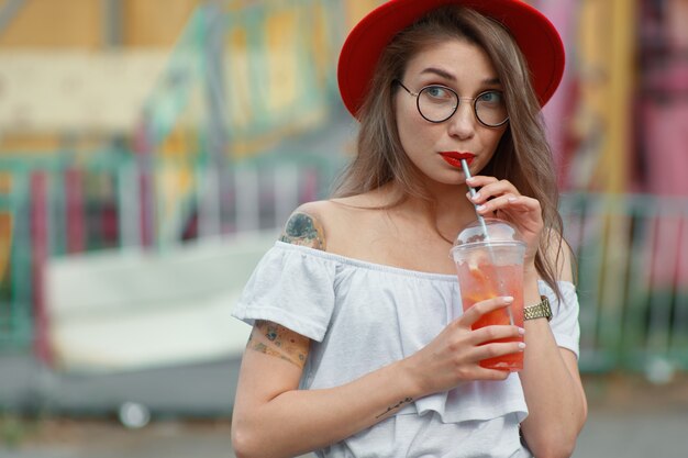 Curious girl  waiting for party news on colorful background