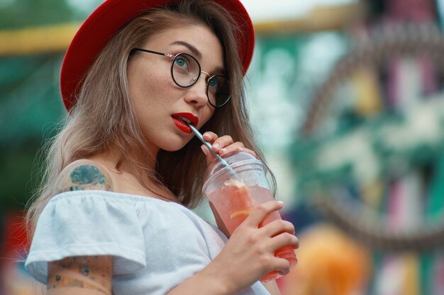 Curious girl  waiting for party news on colorful background