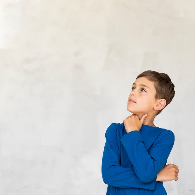 Free photo curious little boy with copy space