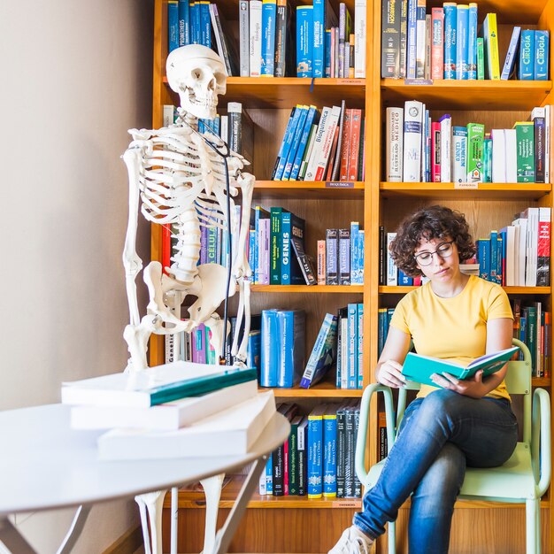 Curly brunette studying book