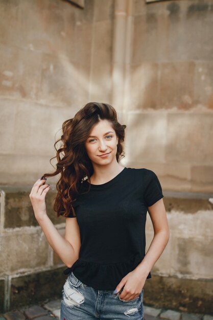 curly girl near building