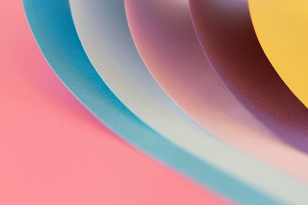 Curved layers of colored papers close-up
