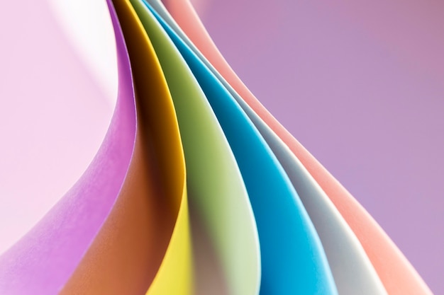 Curved layers of colored papers empty background
