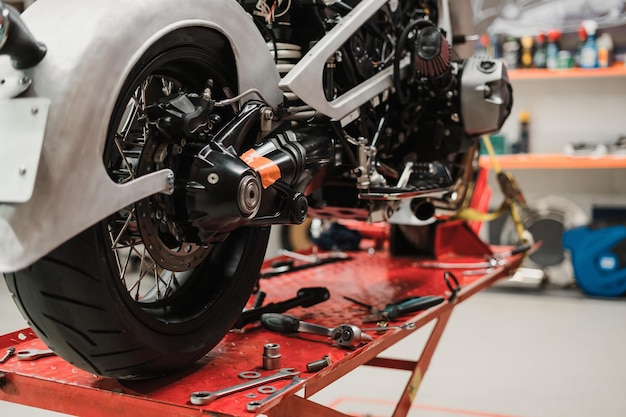 Custom motorcycle standing in repair shop