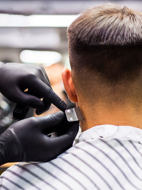 Customer getting a new haircut from behind