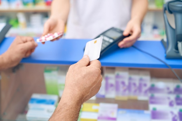Customer paying for pills using credit card