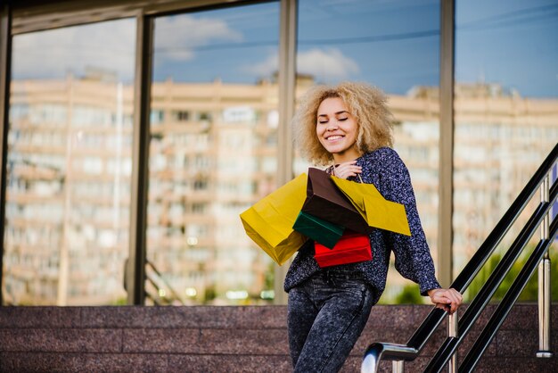 Customer with eyes closed holding bags