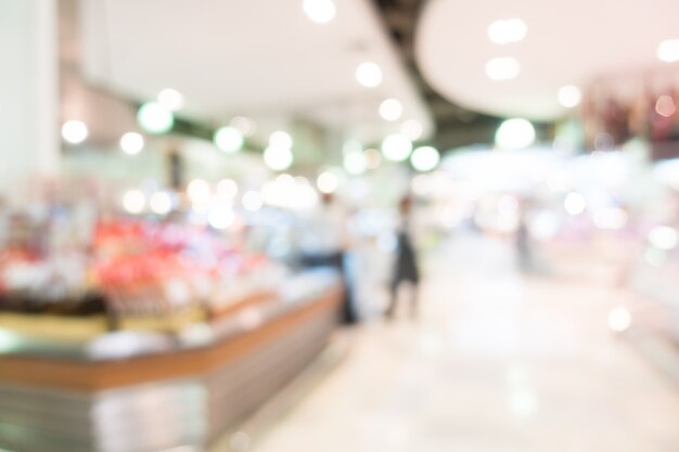 Customers in the supermarket with bokeh background