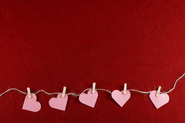 Cut out paper hearts on rope