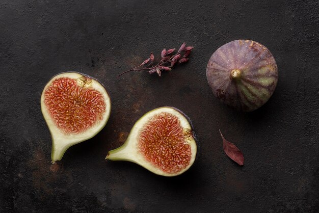 Cut pomegranate fruit and leaves