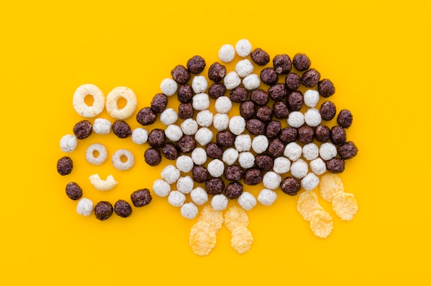 Cute abstract bee made with white and brown cereals