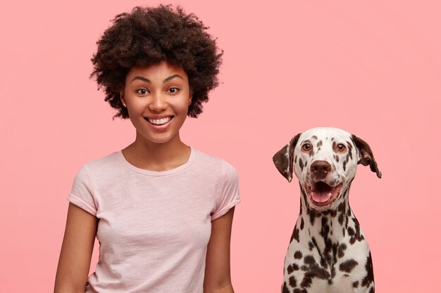 Cute African-American woman with dog