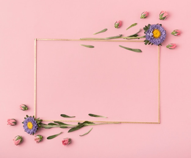 Cute arrangement of a horizontal frame with flowers on pink background