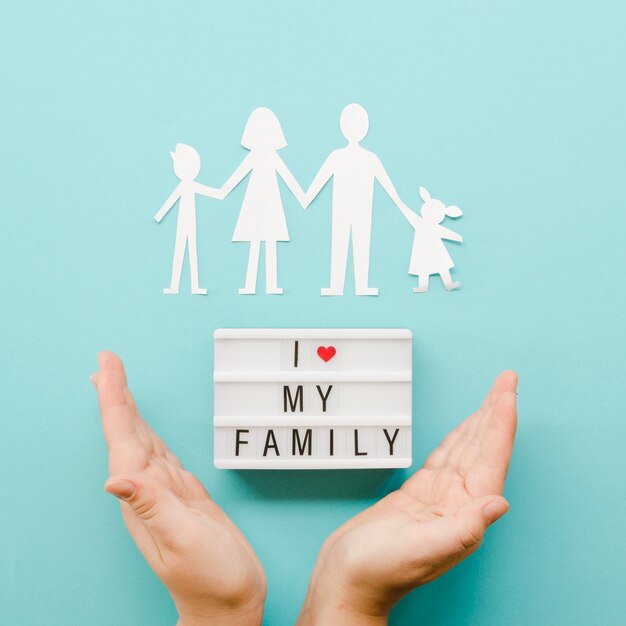 Cute arrangement of paper family on blue background