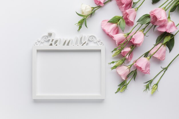 Cute arrangement with roses and vintage frame