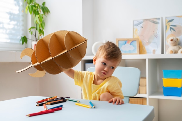 Cute astronaut kid playing