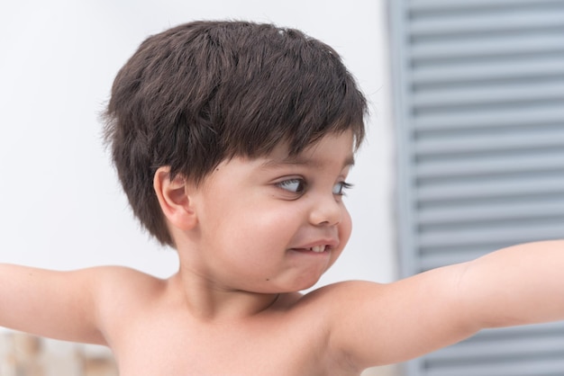 Free photo cute baby boy having fun outdoors