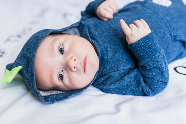 Cute baby on dinosaur pajamas